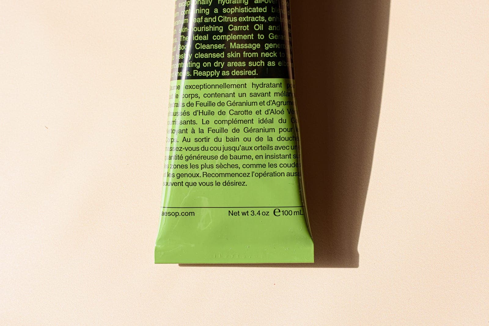 A close view of the printed ingredient label on a cosmetic tube